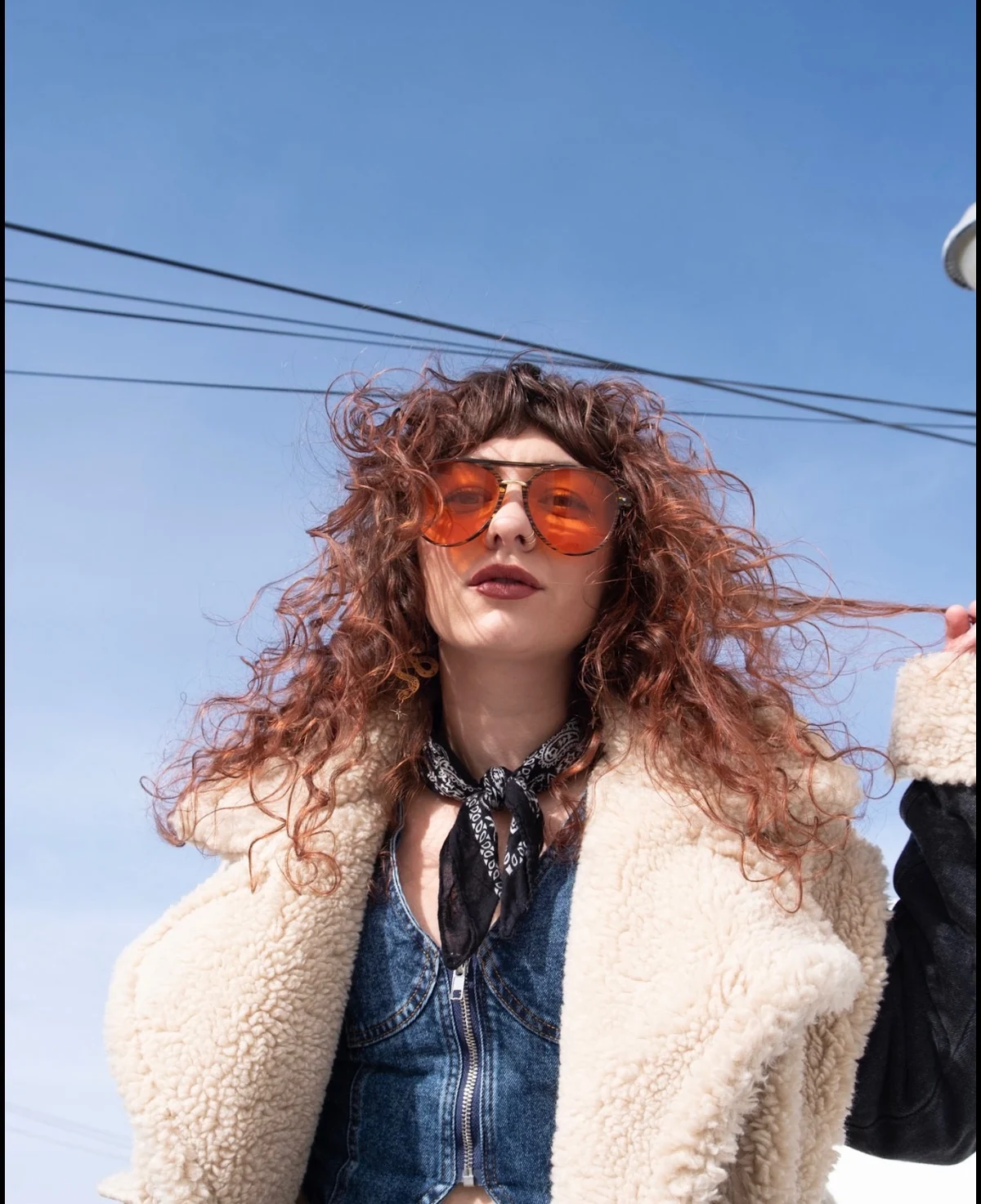 Tyra Whitson in orange glasses in the sunlight